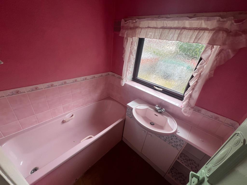 Lot: 13 - TWO-BEDROOM SEMI-DETACHED HOUSE - Bathroom with vanity wash hand basin and window to the rear